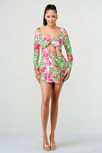 Floral Print Cut-Out Mini Dress: A vibrant mini dress featuring a bold floral print in pink, green, and white. The dress has a twist-front cut-out design at the bust and ruched detailing with a drawstring on the side.