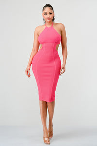 Sleeveless halter neckline bodycon dress with cut-out detailing and open back, knee-length design, zipper closure, made from stretchable polyester fabric, offering a slim fit for the modern woman Rêve Dorés