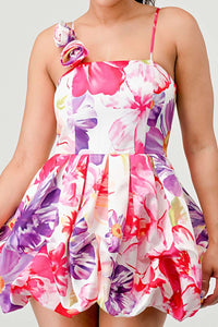 Introducing our Floral Bubble Mini Dress, a charming ensemble that effortlessly blends style and comfort for the modern woman. Crafted with care, this dress is designed to elevate your wardrobe with its delightful features. Embrace the warmth of sunny days with the spaghetti strap design, offering a hint of allure while keeping you cool and comfortable. The sleeveless cut adds a touch of sophistication, perfect for both casual outings and special occasions. - Rêve Dorés