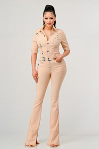 Elevate your style with the Rêve Dorés Washed Denim Half Sleeve Jumpsuit. This jumpsuit features a vintage washed denim fabric that exudes a cool and laid-back vibe. The button-up front adds a touch of retro charm, while the fitted style highlights your curves in all the right places.<br data-mce-fragment="1">