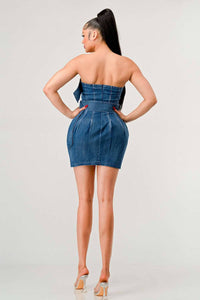 Model showcasing a strapless denim dress with pleated front and belts Rêve Dorés