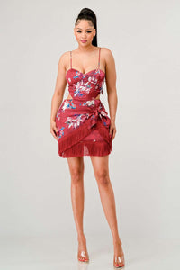 Elegant red floral dress with side cut-out and adjustable strap features by Rêve Dorés