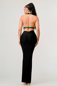 Full-length black dress with green halter top