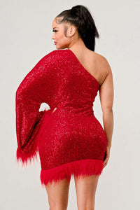 Azure Allure One-Shoulder Dress - Model wearing a glamorous one-shoulder mini dress in vibrant red, adorned with shimmering sequins and featuring a dramatic single sleeve. The hem and sleeve are accented with feathered detailing, adding a bold and luxurious touch, perfect for special occasions or holiday parties. -Rêve Dorés