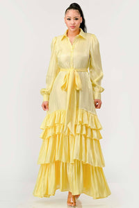 Elegant Yellow Ruffled Maxi Dress: This elegant yellow maxi dress is designed with tiered ruffles on the skirt, long puff sleeves, and a collared neckline. The dress includes a fabric belt to cinch the waist. Rêve Dorés