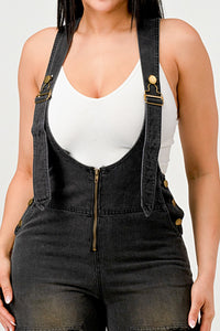 Urban Noir Denim Overalls Black Jumpsuit. Rêve Dorés Model wearing a stylish black denim overall jumpsuit featuring wide-leg pants, adjustable straps, and a front zipper closure. Paired with a white fitted tank top, this outfit offers a chic and modern twist on classic overalls, perfect for casual yet trendy looks.