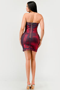 Hellcat Denim Dress | Model wearing a strapless mini denim dress in a bold red and black ombre design, featuring structured stitching details and a flattering bodycon silhouette. Perfect for a chic and edgy evening look - Rêve Dorés