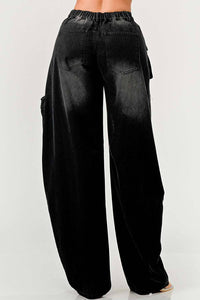 Black wide-leg denim cargo pants featuring distressed knees and pockets