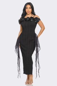 Elegant off-shoulder black midi dress with rose appliques and side tulle accents by Rêve Dorés