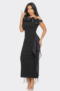 Stylish black body-hugging midi dress with off-shoulder rose adornments and side tulle drapery by Rêve Dorés