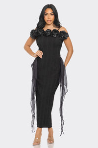 Chic black midi dress with shoulder-baring cut and decorative rose detailing by Rêve Dorés