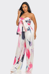 Chic and elegant wide-leg jumpsuit with a strapless neckline and abstract brushstroke design
Rêve Dorés