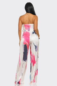 Trendy strapless jumpsuit with a fashionable bow detail and vibrant abstract print
Rêve Dorés