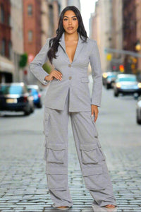 Light grey cargo-style suit featuring a tailored blazer with a two-button closure and wide-leg cargo pants with multiple pockets. A chic blend of utility and sophistication.